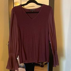Plum colored rayon spandex blouse with beautiful sheer balloon sleeves.